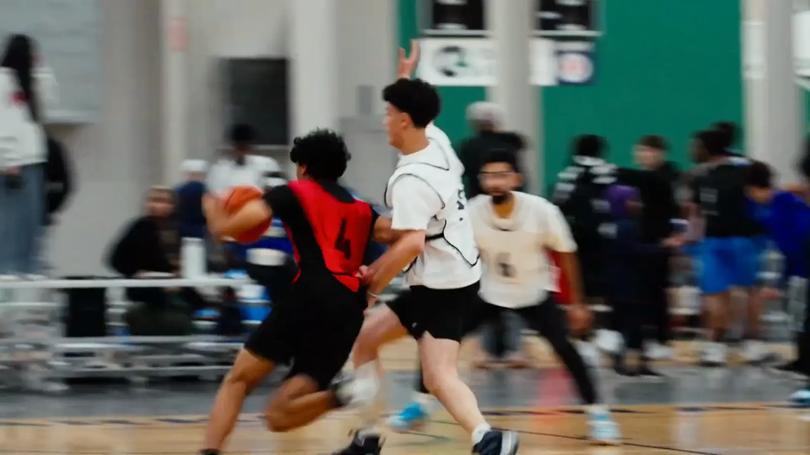 Two players driving to the basket during a tournament game