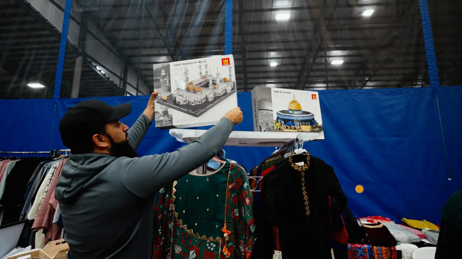 Shoppers browsing a clothing stall at the bazaar